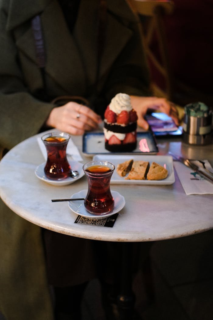 Enjoy a delightful café scene with Turkish tea and dessert in İstanbul, Türkiye.